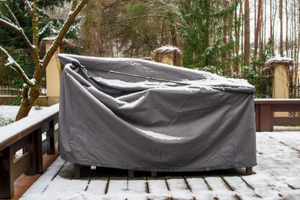 patio furniture covered winter GettyImages 1294474236 MLedit